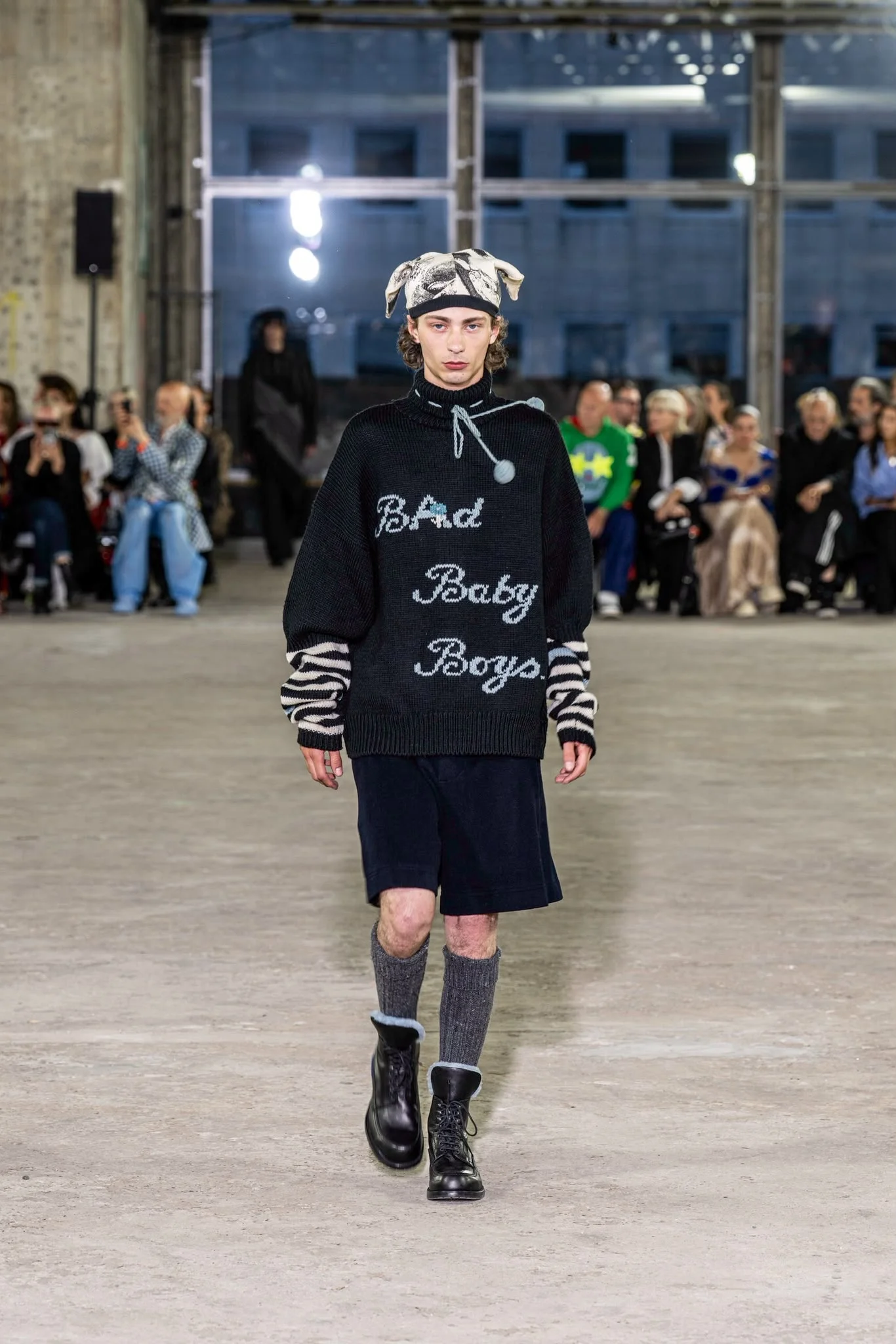 Model in knitwear on the runway
