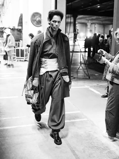 Model on the runway in black and white